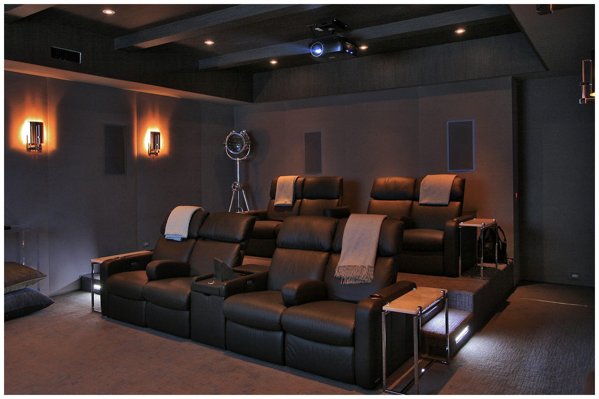 THEATER IN A DEDICATED ROOMThe before and after picture illustrate how two interconnected rooms in a finished basement were joined and subsequently turned into a dedicated basement theater.Special treatment of the ceiling limited intrusion of sound into upper floor.
