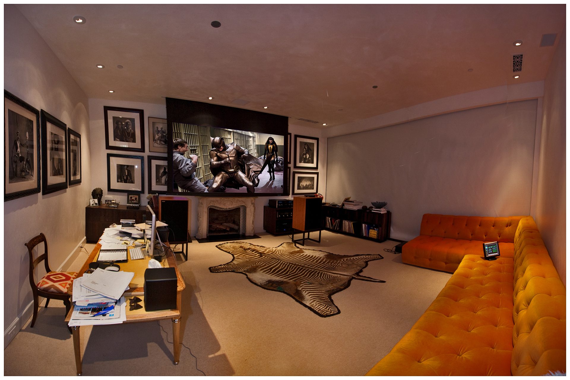THEATER IN A DEDICATED ROOMOur Client’s desire for high-end Music and a large screen were combined into this office workspace where he was able to listen to music, watch video, and work.